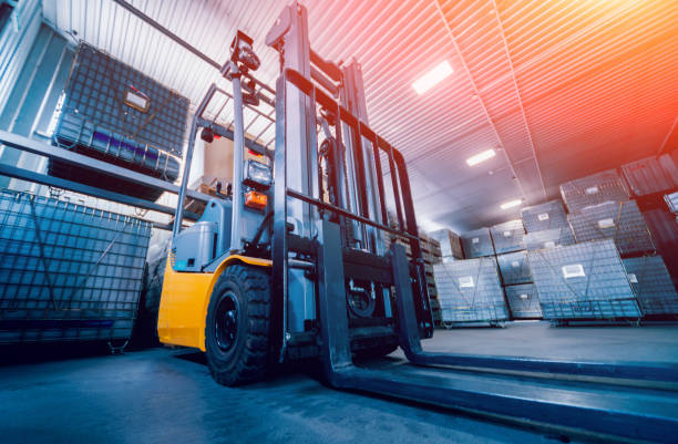 Forklift loader. Pallet stacker truck equipment at warehouse. Background